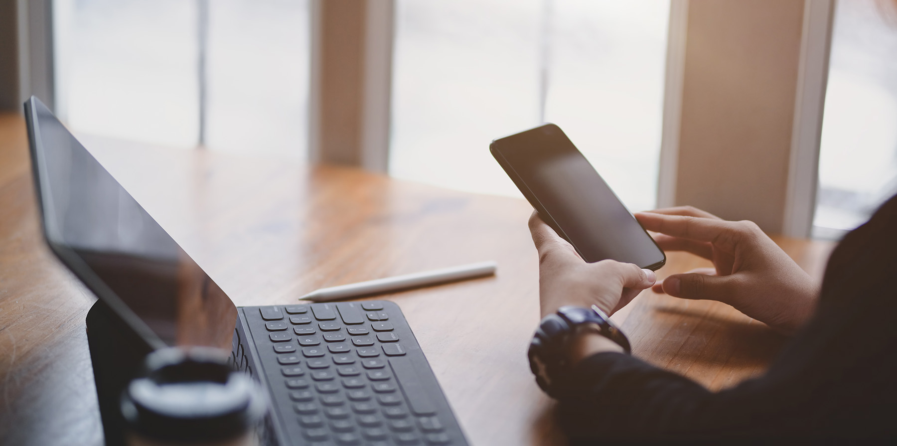 close-up view of businesswoman touching smartphone comfortable-office room
