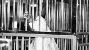 The confines of this little girl's world in the Clement Research Building at Clover Bottom Hospital and School extend only to the metal bars surrounding her crib Dec. 20, 1971.